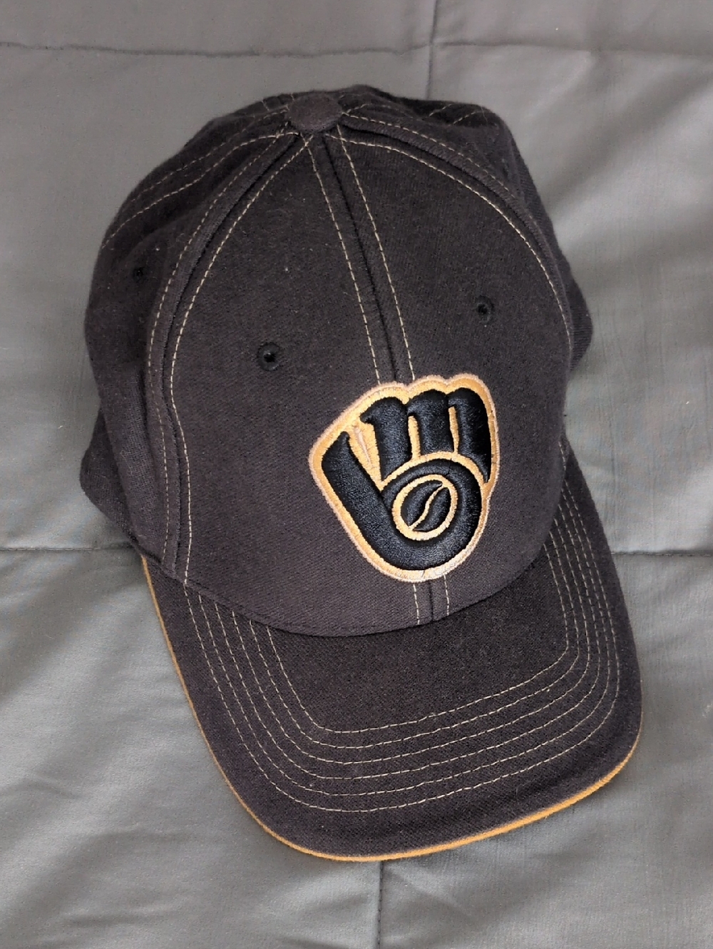 Black and Tan Baseball Cap with Embroidered Glove Logo